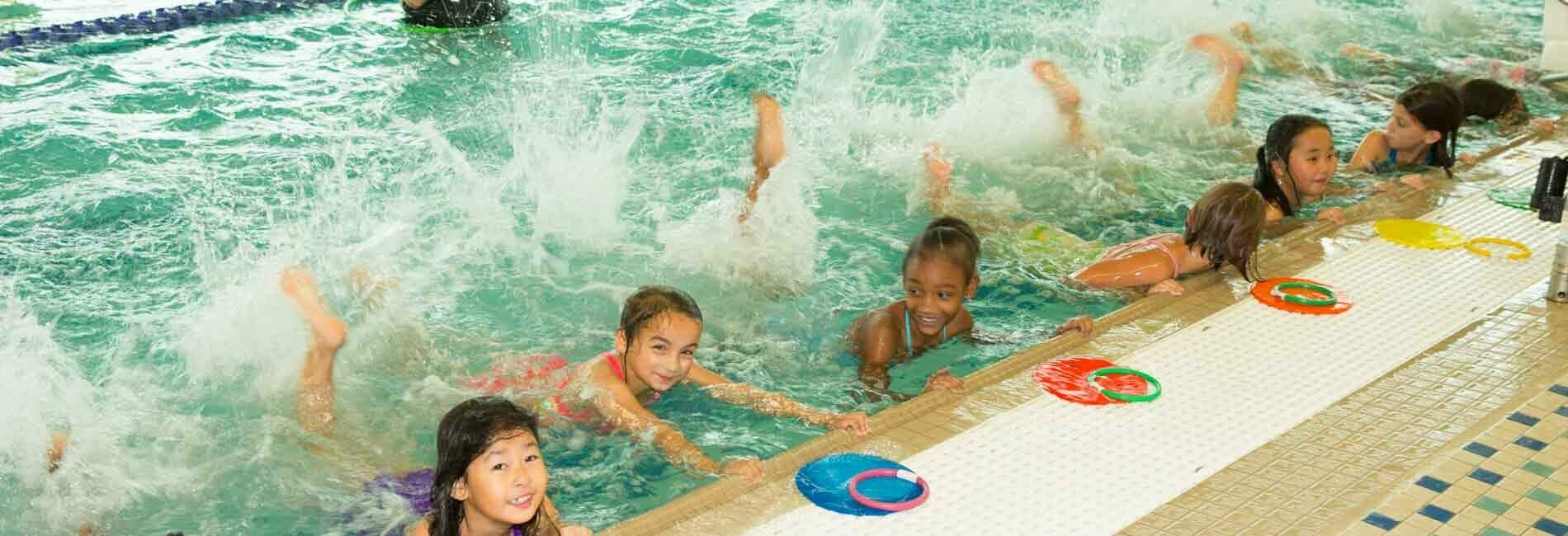 Students on Wall of Swimming Pool
