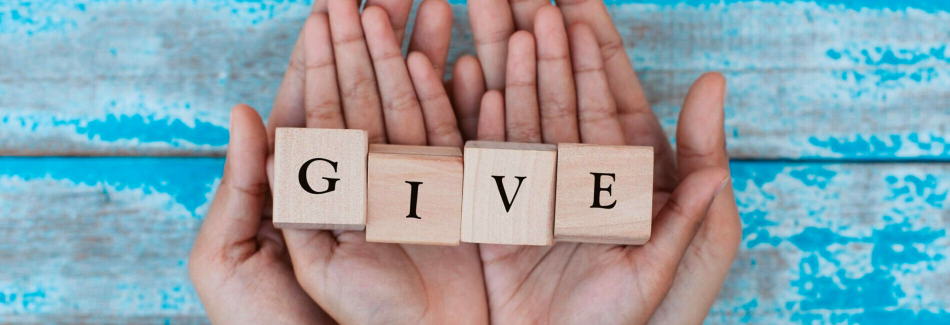 Hands Holding Blocks Spelling Give